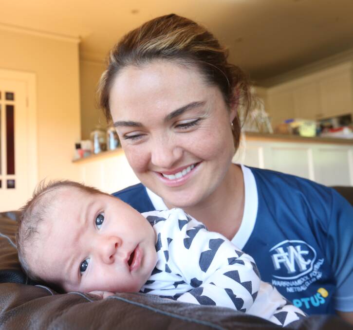 NEW CHALLENGES: Emma Cust, pictured with four-week-old son Tex, is excited to return to Warrnambool as A grade coach. Picture: Vicky Hughson