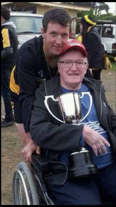 MEMORIES: Adam Courtney and dad John celebrate Simpson's 2014 premiership. Courtney coached the Tigers to two Colac and District league flags. 