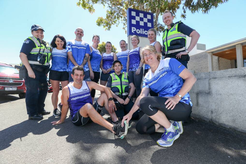 TEAM WORK: Senior Sergeant Di Thomson (front right) delivers care to Leading Senior Constable Greg Kew  (front left) ahead of the Surf 'T' Surf. Picture: Michael Chambers 