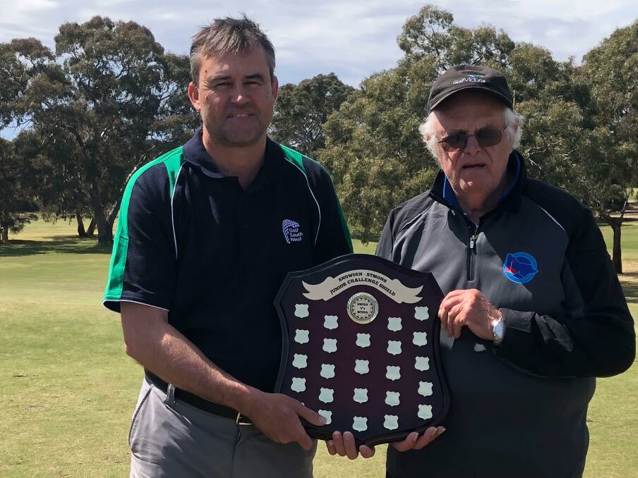 HUMBLED: Country Victoria golf duo Steve Symons and John Snowden with the golf shield struck in their names.