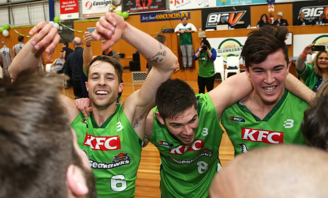 WE ARE THE CHAMPIONS: Nathan Sobey, James Mitchell and Brock Carter sing the song after the Seahawks' title win. Picture: Rob Gunstone