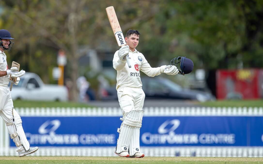 RAISE THE BAT: Geelong's Tommy Jackson celebrates his century in the Victorian Premier Cricket first XI grand final. Picture: Cricket Victoria 
