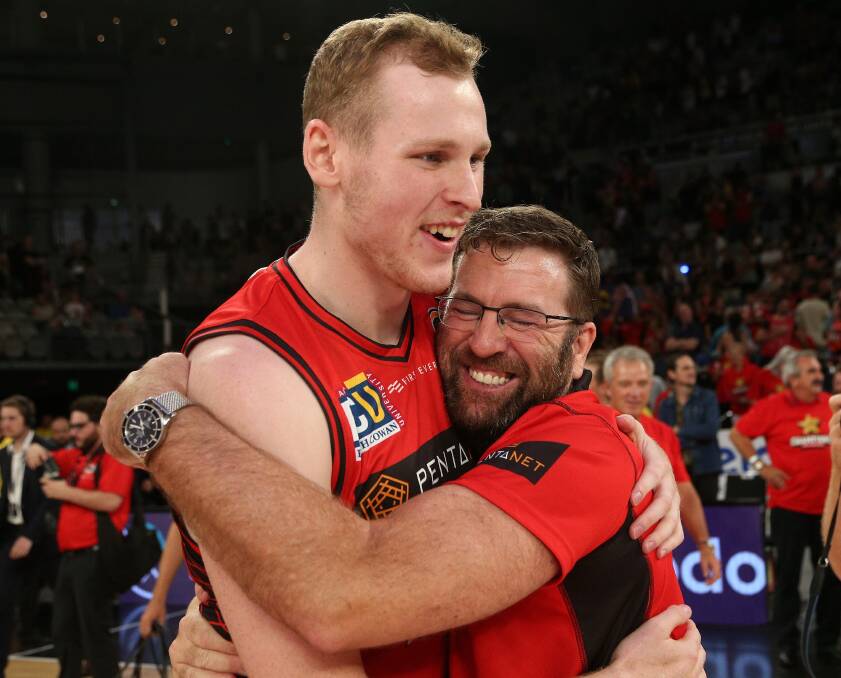 THANKS MATE: Trevor Gleeson (right) celebrates Perth Wildcats' 2018-19 NBL championship win with player Rhys Vague in Melbourne on Sunday. Picture: AAP  