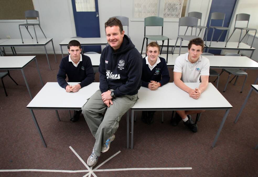 INSPIRATION: Warrnambool College teacher Adam Dowie, pictured with his former Blues players Liam Hoy, Kurt Lenehan and Sam Cowling in 2009, says he loves watching his students succeed on the football field.