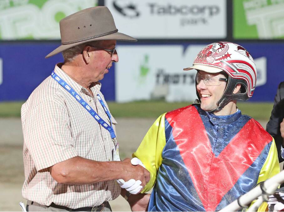 CONGRATULATIONS: Cudgee hobby trainer John Meade and driver Chris Svanosio celebrate Sparkling Success' win in a $300,000 trotting race.