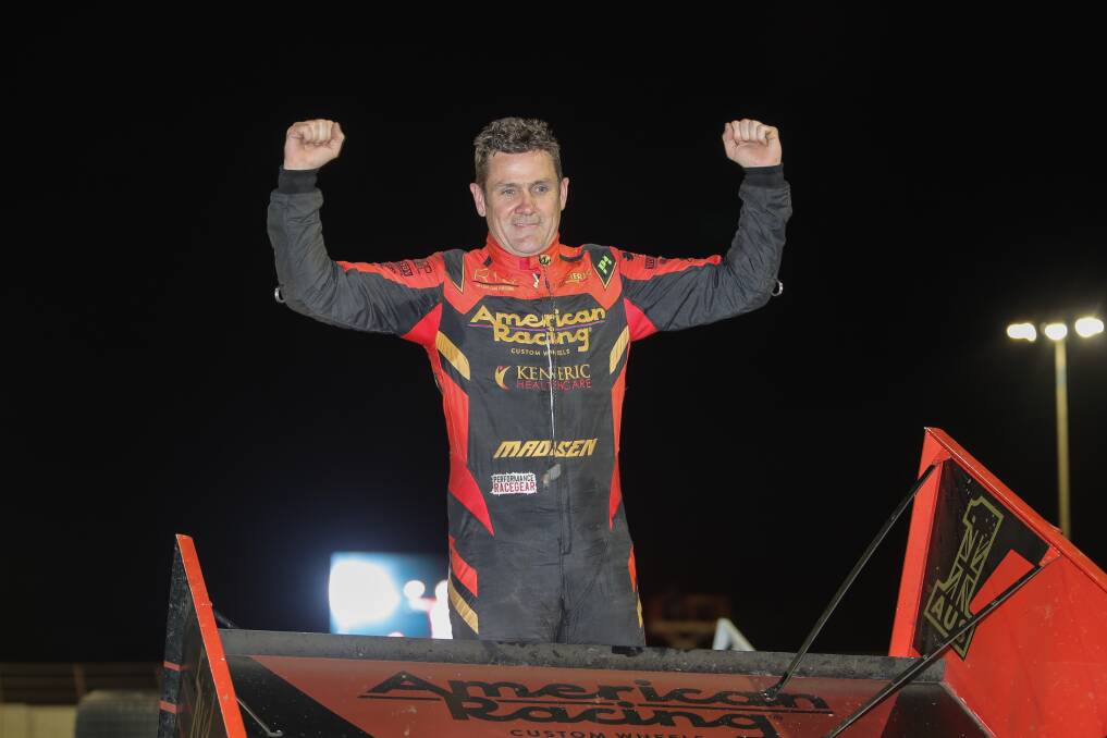 ON TOP OF THE WORLD: Kerry Madsen celebrates his Speedweek success atop his Australian number one car. Picture: Morgan Hancock