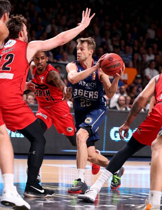 OUTTA MY WAY: Warrnambool export Nathan Sobey weaves his way to the basket in Adelaide's rout of Perth in game one of their NBL semi-final series. Picture: AAP
