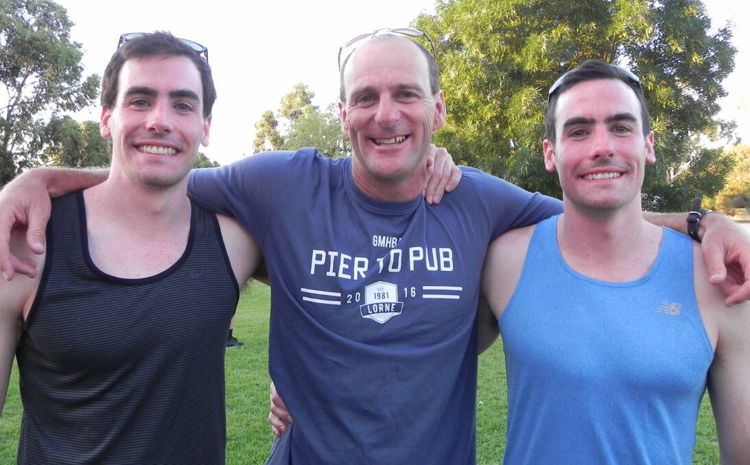 PROUD: Warrnambool Swimming Club coach Jayson Lamb (middle) with newly-inducted life members Jack and Michael Paulka.