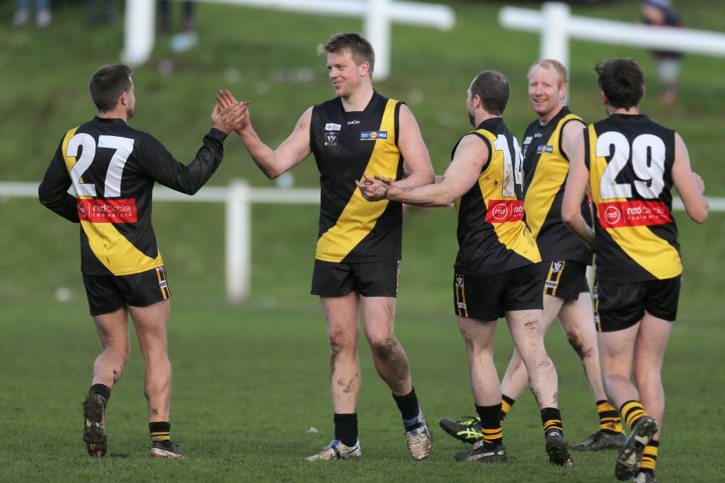 Jet Dowie celebrates with (from left) Josh Sobey, Gareth Crawford, Scott Kelly and Lachlan Kelly after kicking a goal against East Warrnambool at Merrivale Recreation Reserve. Picture: Rob Gunstone