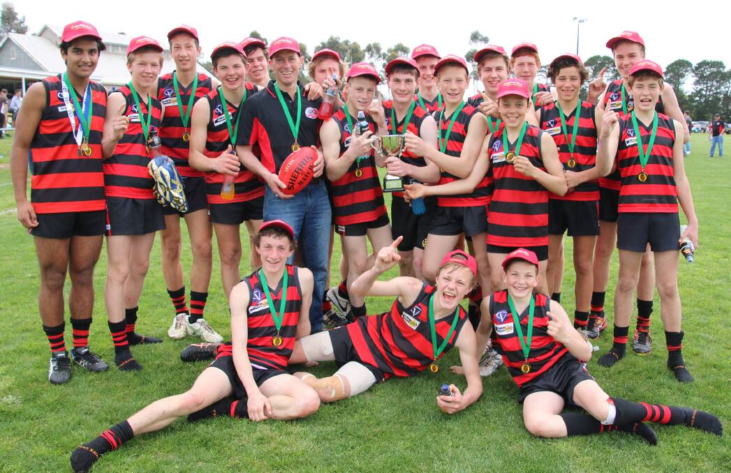 DONE IT: Penshurst coach Brendan Mills and his players are all smiles after defeating Moyston-Willaura in the under 16.5 grand final. Picture: Tracey Kruger