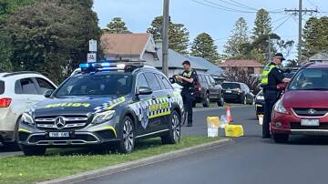 Warrnambool highway patrol unit officers conduct a breath testing site in Banyan Street on Sunday afternoon.