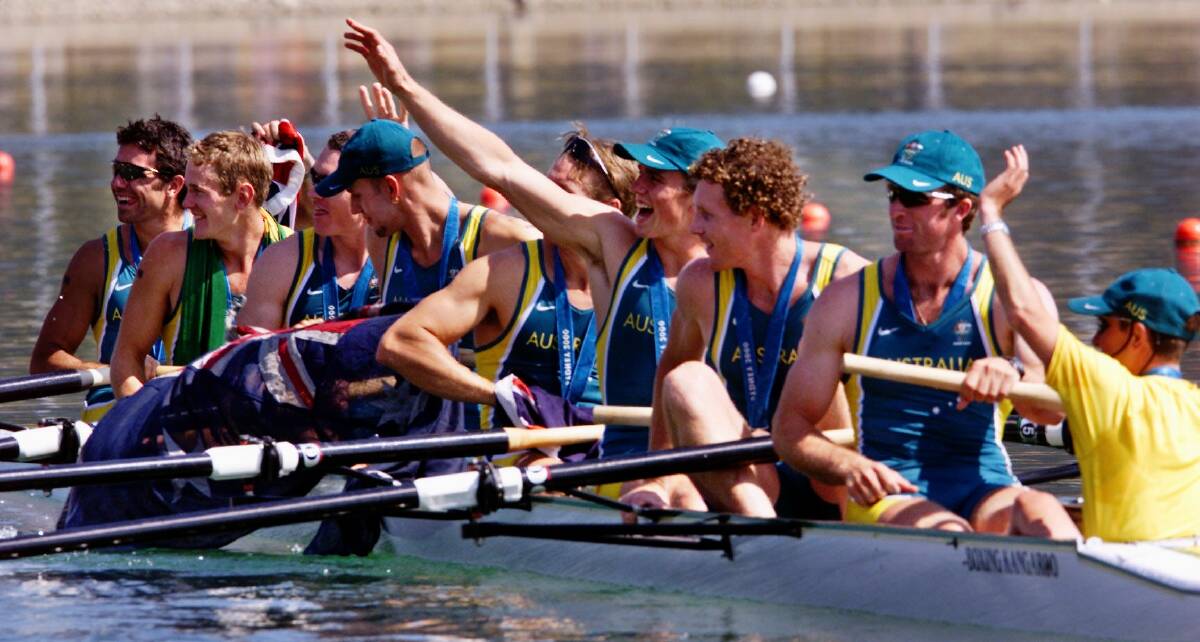 CELEBRATING: The men's eights rowing team celebrate after crossing the line..