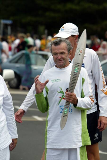 PROUD REPRESENTATIVE: Colin Silcock-Delaney carries the Queens' Baton during the relay ahead of the 2006 Commonwealth Games.