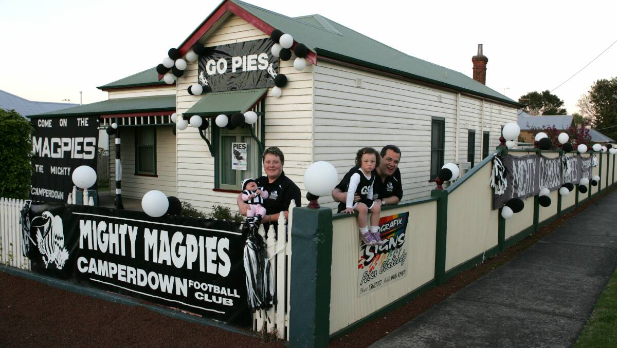 FAMILY AFFAIR: Sophie, Donna, Maggie and Peter Conheady show their true colours ahead of the 2006 Hampden league grand final.