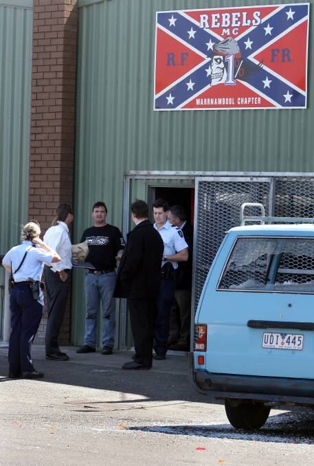 Flashback: Warrnambool police officers chat with bikies outside the Warrnambool Rebel club shed at Silverton park in 2008. The man arrested on warrants yesterday is not in this image.