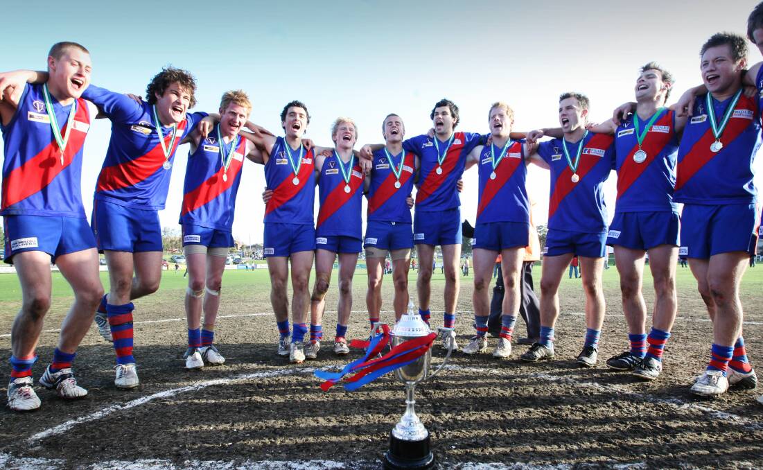 REWARD: Terang Mortlake players gathered in the middle of Reid Oval after their 2008 grand final win to sing the club song and check out the premiership cup.