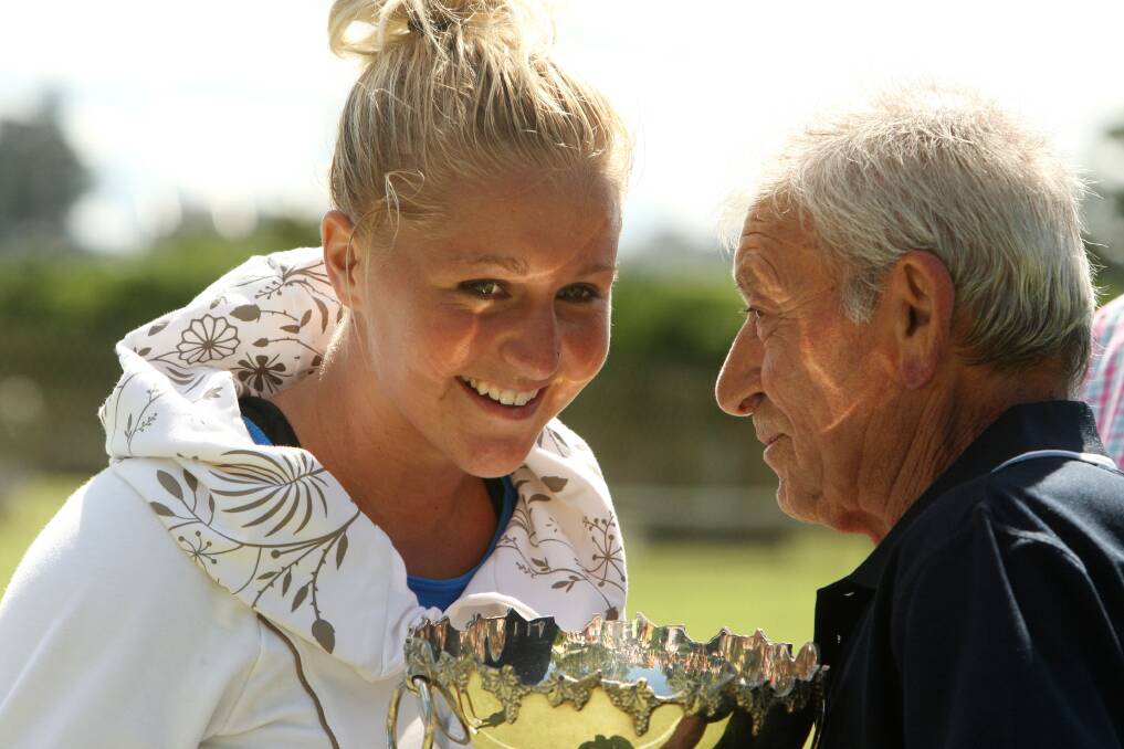 BACK IN THE DAY: Theo Kotsabakidis presents Olivia Rich with her trophy after winning the Women's Open singles Final at the 60th Annual Warrnambool Lawn Tennis Club Open Tournament in 2010. 