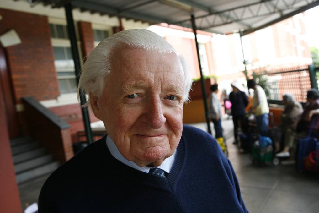 STILL GIVING: Mr Brophy's family has remembered him as giving throughout his whole life. He is pcitured at his charity food centre in Richmond. Picture: The Melbourne Times