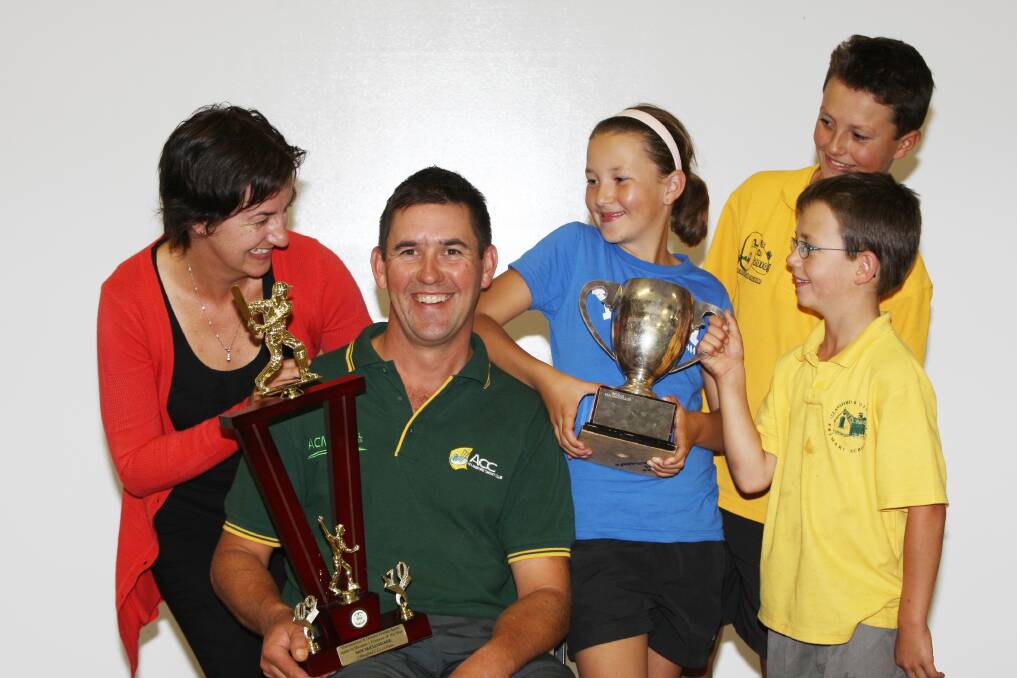 FLASHBACK: Warrnambool and District Cricket Association divison one cricketer of the year Sam McCluggage with wife Christine and children Bella,9, Hugh,12, and Myles, 6, in 2009. 
