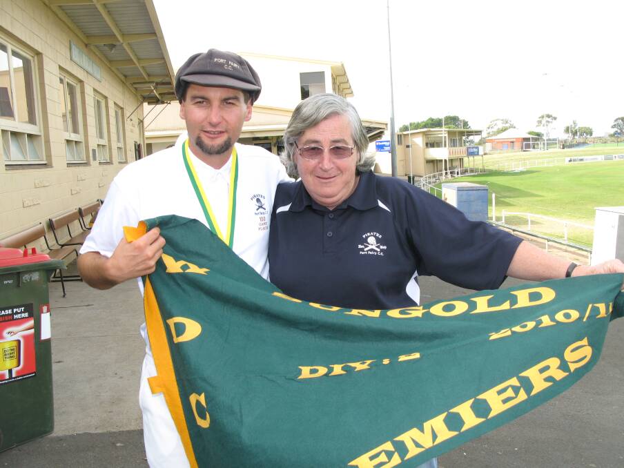 PREMIERS: Richard and Phillipa Hodgens proudly hold the club's 2011 division two premiership flag proudly.