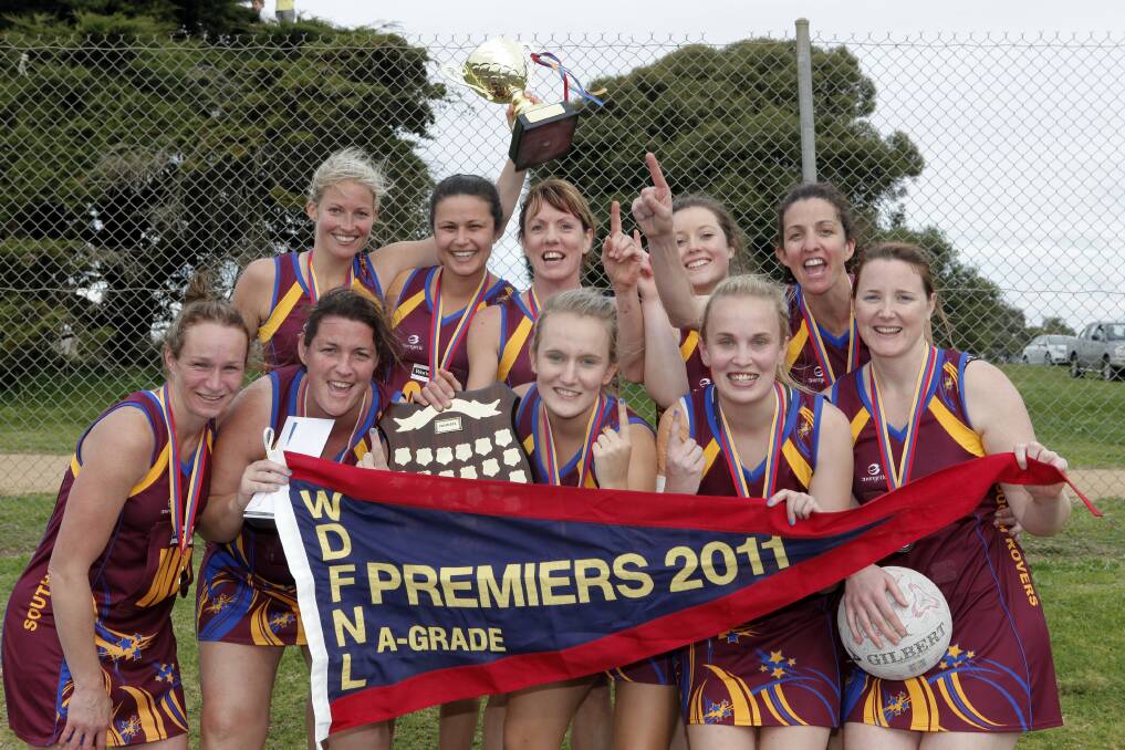 Number one: South Rovers and Rhi Davis celebrate after winning the Warrnambool and District league A grade netball premiership in 2011.

