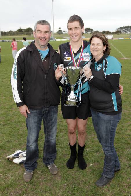 FLASHBACK: Nick Bourke with his parents, Simon and Carmel, celebrating Kolora-Noorat's 2011 grand final win. Bourke was best on ground that day. 