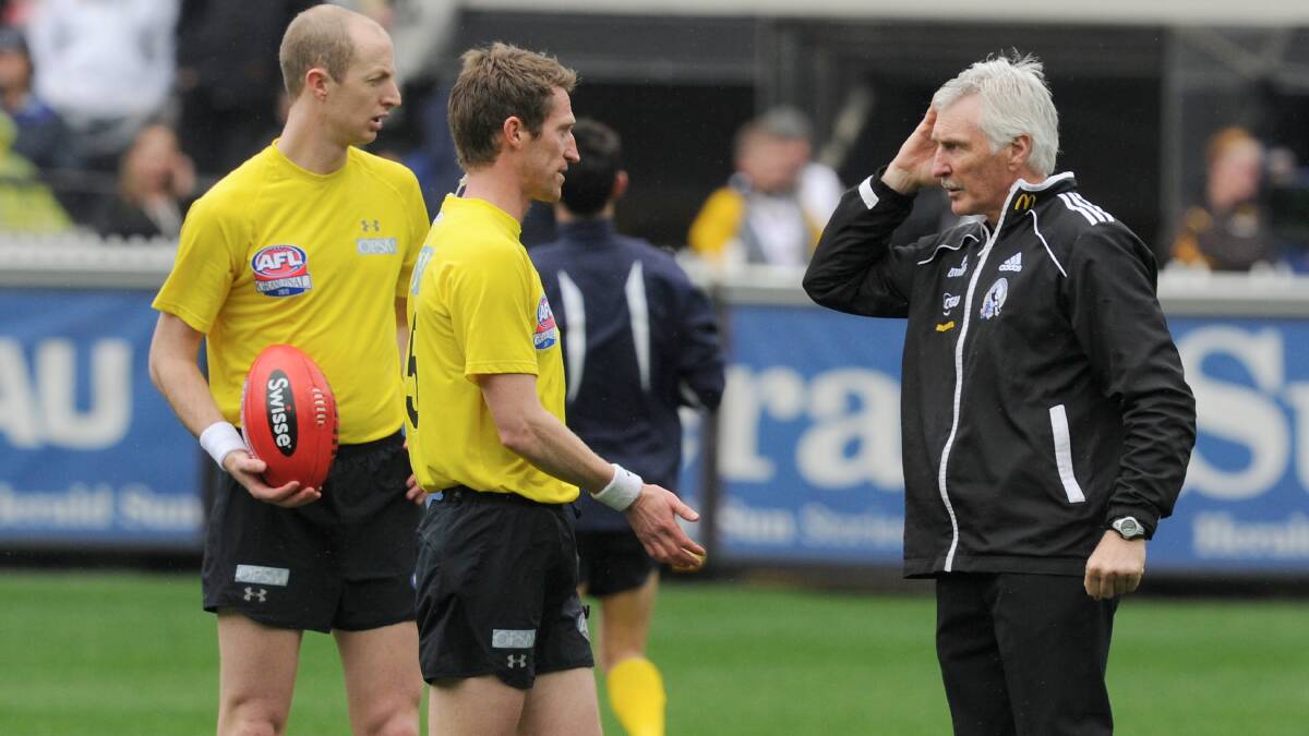 Collingwood coach Mick Malthouse with umpire Shaun Ryan before the game. Picture: Sebastian Costanzo. The Age.