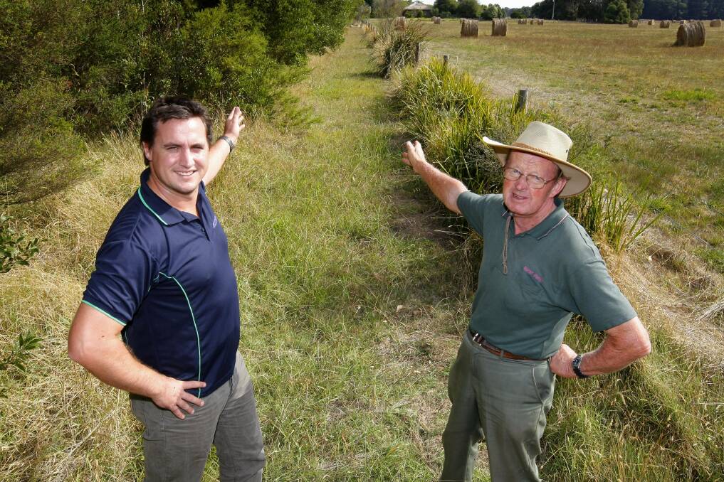 WELCOME NEWS: David Pope and Alan Kerr, pictured at the proposed site of the Twelve Apostles Trail in 2012, are delighted the government will fund the project. Picture: Rob Gunstone