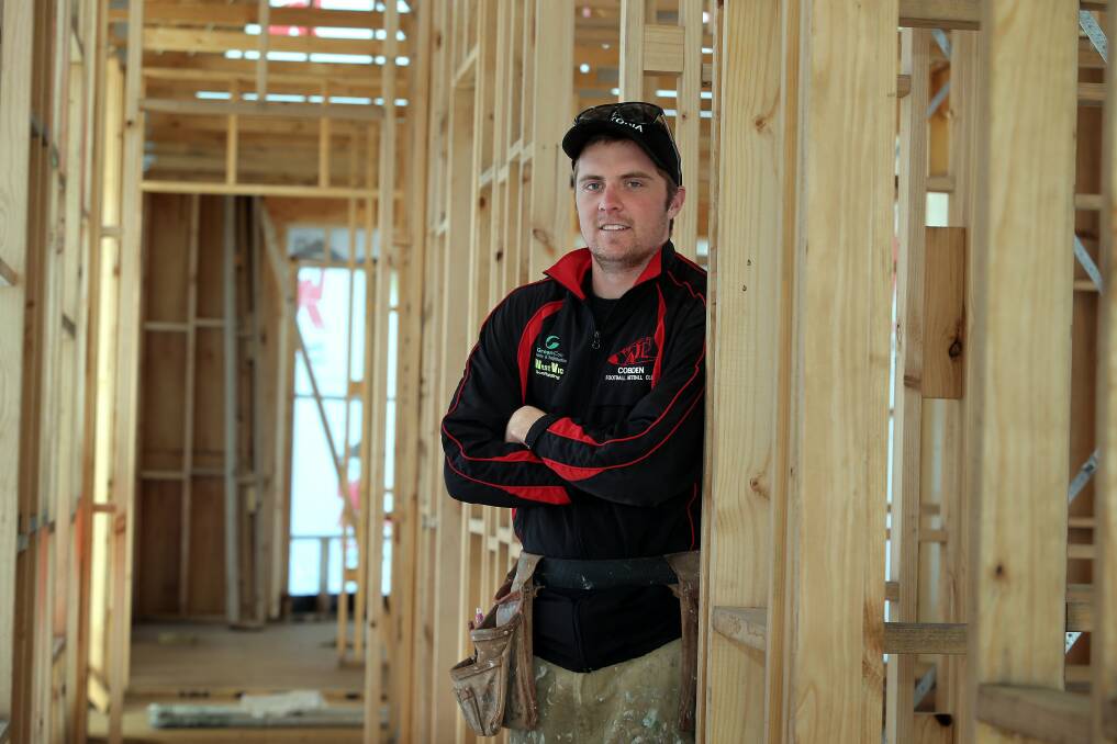 THROWBACK: Louis Cahill circa 2012 on a building site. The Cobden footballer was pictured at work in the lead-up to the Bombers' grand final appearance against Warrnambool. 