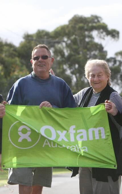 Walking for others: Warrnambool Oxfam group members Greg Hillman and Fay Armstrong promote its 50th anniversary fund raising walk on February 5. 
