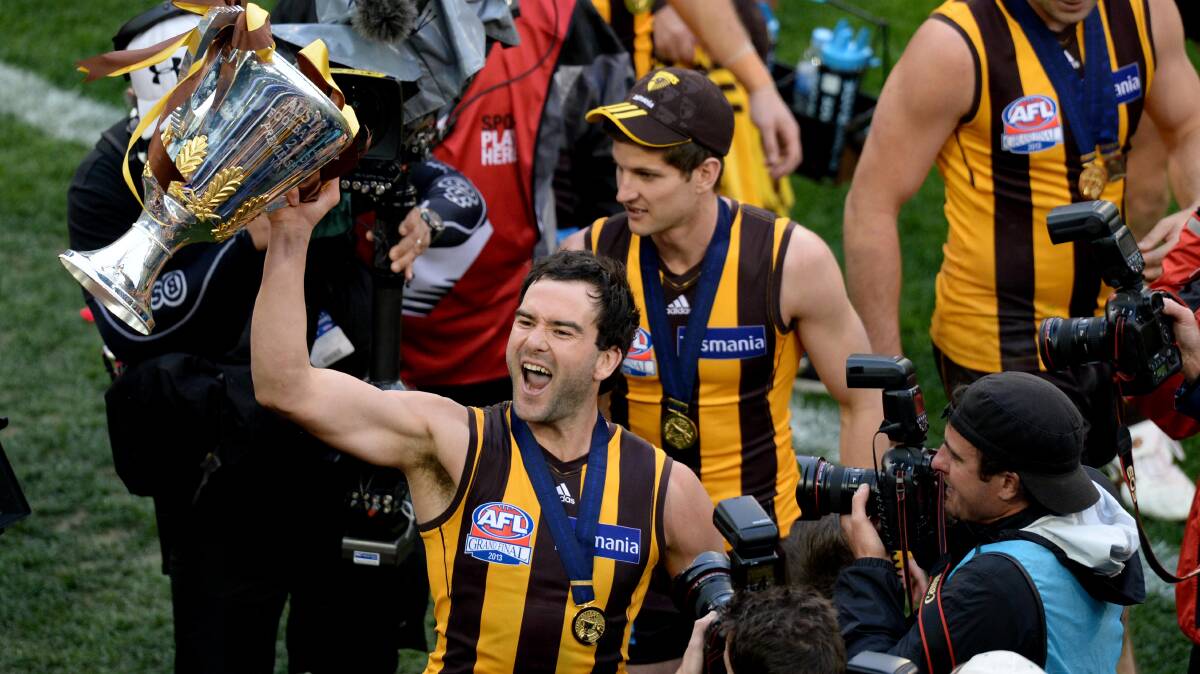 GOOD TIMES: Jordan Lewis celebrates Hawthorn's 2013 premiership, which was his second flag with the club. Picture: Mal Fairclough