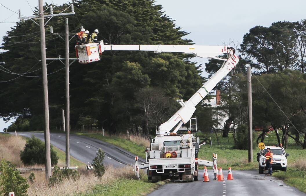 Powercor workers are being kept busy due to the high winds today. This is a file image of works at Tarrone Lane.