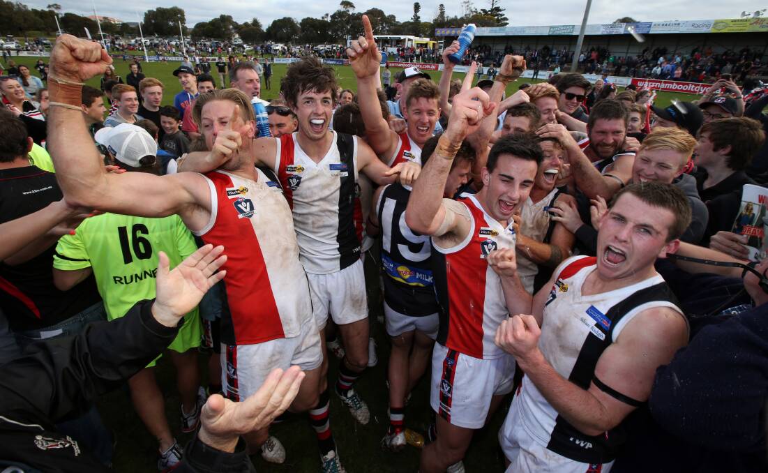HERE WE GO: Wild celebrations erupted after Koroit pulled off an upset win in the 2014 Hampden league grand final over Warrnambool. It was the start of a history-making run for the Saints. 