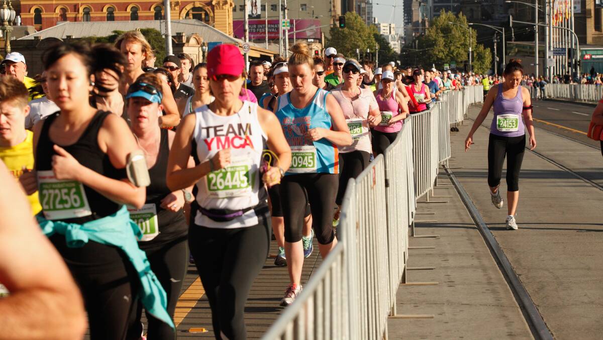 Competitors run through the city at the Melbourne Marathon. Picture: Chris Hopkins