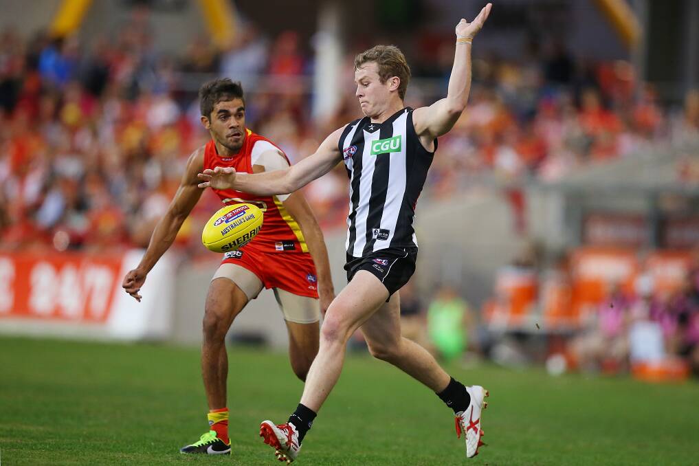 SOUTH-WEST RETURN: South Warrnambool export Sam Dwyer in action for Collingwood against Gold Coast during the 2014 AFL season. He will play for Old Collegians in 2018.