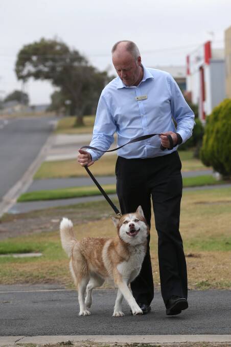Just do it: Warrnambool City Council's Local Laws coordinator Peter McArdle, with husky Arabella, wants dog and cat owners to register their animals.