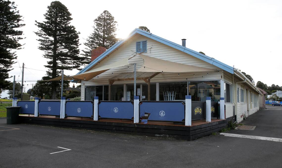 Gone: The single-story building at the Port Fairy wharf will be replaced by a new structure which will include a restaurant and fish and chip shop. Picture: Rob Gunstone