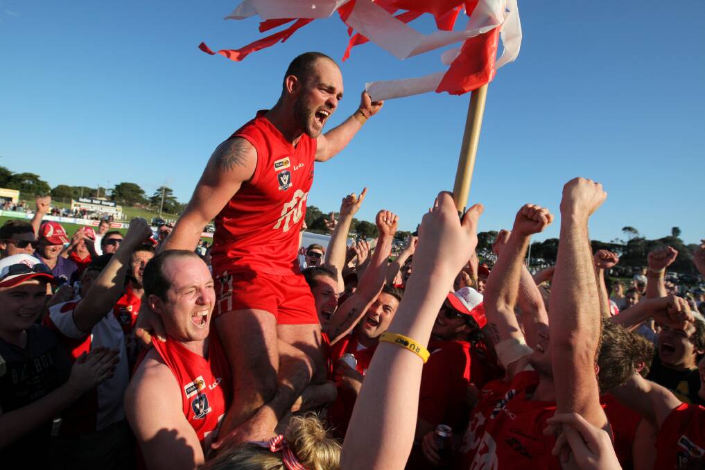 Back: Former Dennington coach Darcy Lewis is lifted after winning the 2015 premiership. He has returned to help the club after coaching at Wickliffe-Lake Bolac.