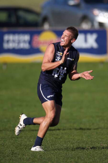FAVOURITE: Jason Rowan celebrates a goal in his playing days with Warrnambool. 