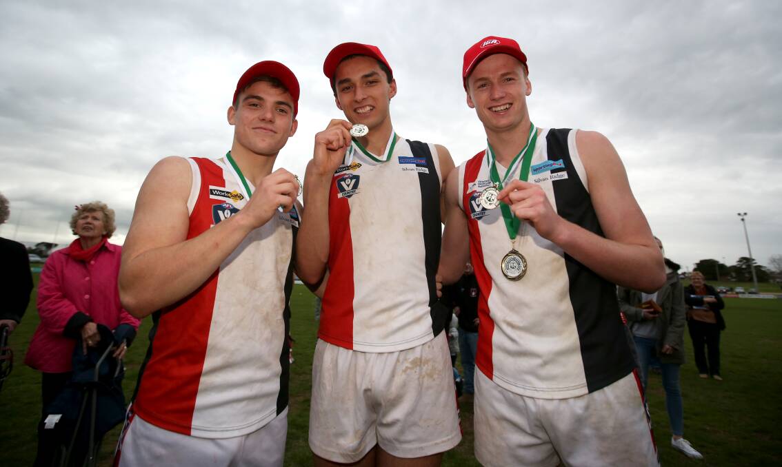 TALENTED TRIO: Koroit's three North Ballarat Rebels players James Gow, Jarrod Korewha and Willem Drew celebrate with their medals after the 2016 Hampden league grand final. Drew was drafted to AFL club Port Adelaide a few months later.