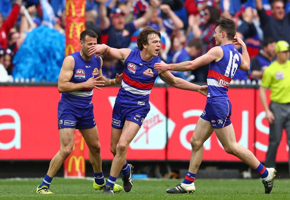 Match-winner: Liam Picken celebrates after booting a goal for the Western Bulldogs in the 2016 AFL grand final against Sydney. Picture: Scott Barbour