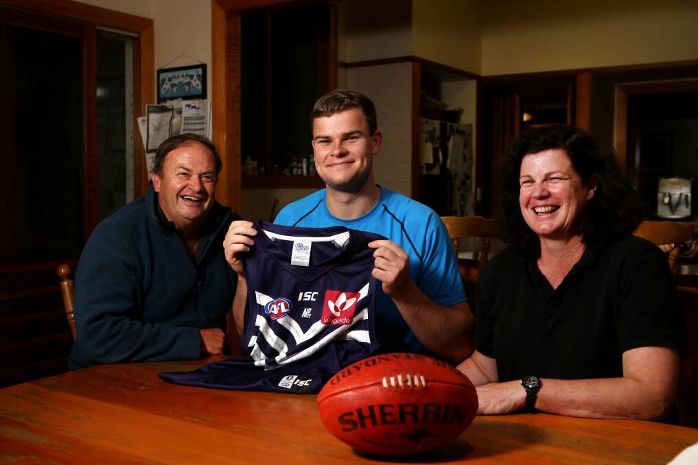 HOME SWEET HOME: Cobden player Sean Darcy celebrates being drafted by Fremantle at pick 38 with parents Greg Darcy and Ann-Maree Sullivan at their house in South Purrumbete in 2016.