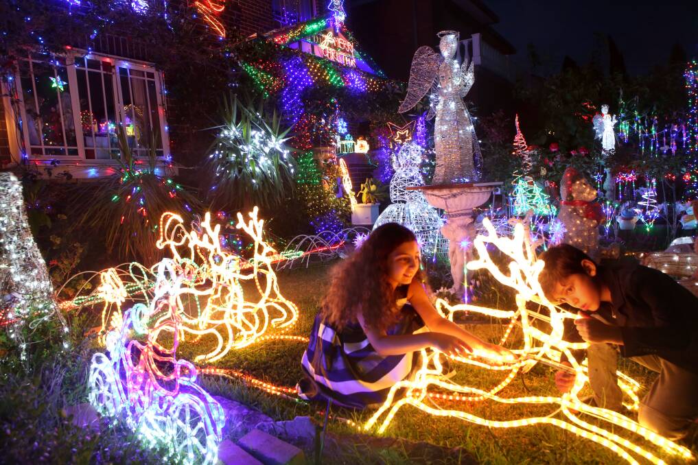 Not so festive: Police have warned residents to lock their homes and said opportunistic thieves could strike when families head out to look at the Christmas lights, stealing presents including phones and electronic items. 