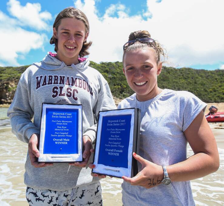 CHAMPIONS: Overall Shipwreck Coast Swim Series winners Hamish Rowland, 16 from Melbourne, and Sophie Thomas, from Warrnambool, with their trophies. Pictures: Amy Paton