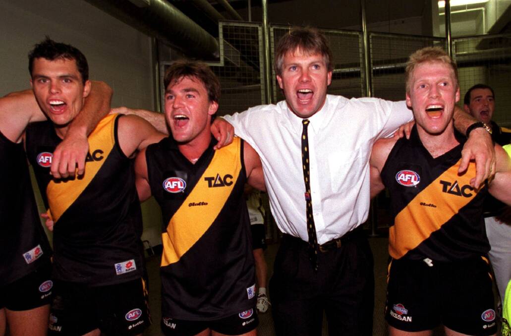 YELLOW AND BLACK: Paul Broderick (second from left) with Andrew Kellaway, Danny Frawley and Matthew Knights, celebrating a Richmond win.