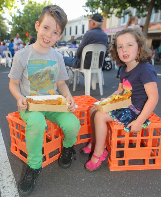 Louis Turner, 8, and Greta Turner, 5, of Winslow, enjoy dinner at the Wunta Fiesta street party. Pictures: Morgan Hancock