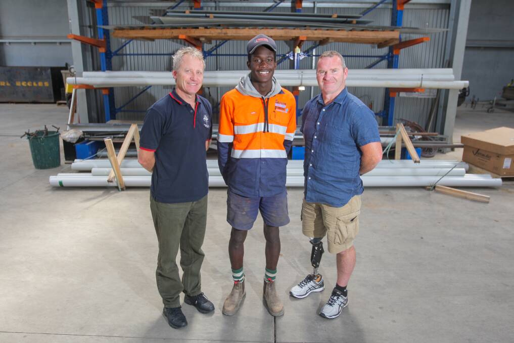 ON THE JOB: Emmanuel College's David Gladman, apprentice Mar Gattek, 17, and Southern Victorian Plumbing's Darren Smith at Mar's workplace. Picture: Morgan Hancock