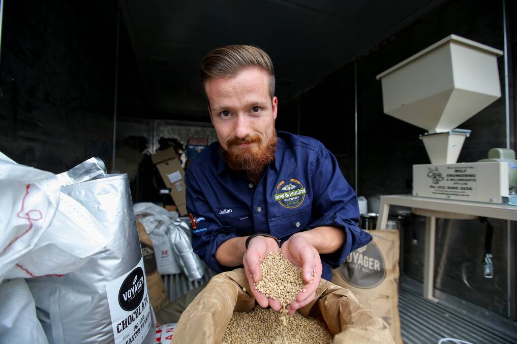 Brewer: Sow and Piglet brewery manager Julian Widera with malted barley for the locally produced beer.