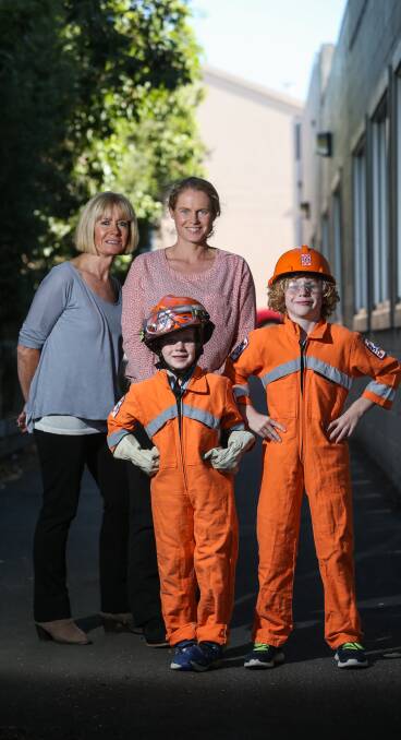 Thinking of volunteers: WASH group's Maggie Dwyer with long-time volunteer Bernadette Northeast and children Charlie, 6, and Edward Northeast, 8. Picture: Amy Paton