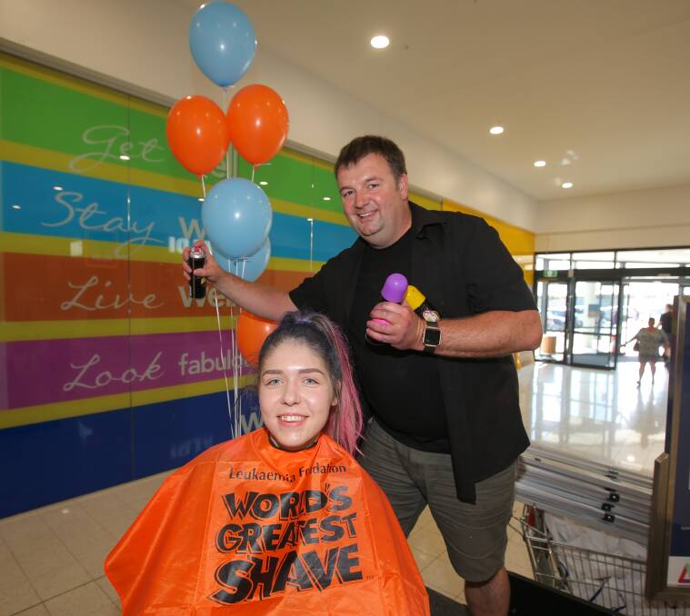 New look: Vaughn Parsons was on hand to spray Tayla Love's hair as part of the World's Greatest Shave. Picture: Morgan Hancock